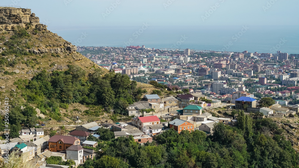 View of the north-eastern part of the city of Makhachkala - the capital of the Republic of Dagestan. On the left, Tarki-tau mountain is visible, in the foreground - Chagar aul
