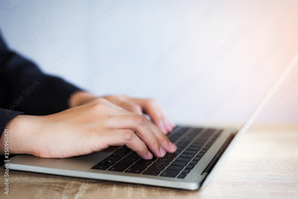 Closeup of business woman working for new project with laptop at sunny office. Closeup of business woman working for new project with laptop at sunny office.