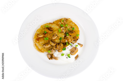 Plate with potato pancakes, fried mushrooms, isolated on white background.