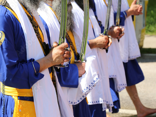 sikh men with swords in the hands photo