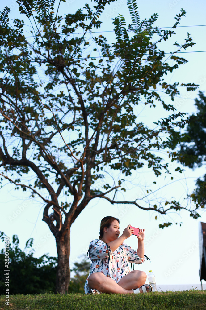 Fototapeta premium portrait of happy fat women in nature
