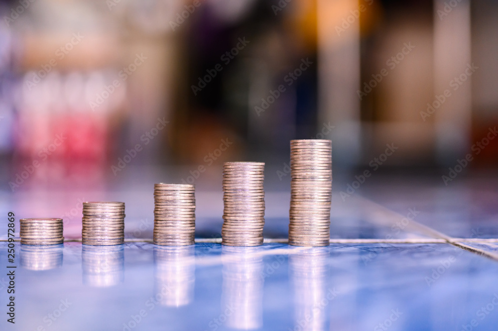 step of coins stacks, money, saving and investment or family planning concept. step of coins stacks, money, saving and investment or family planning concept.