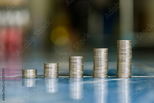 step of coins stacks, money, saving and investment or family planning concept.