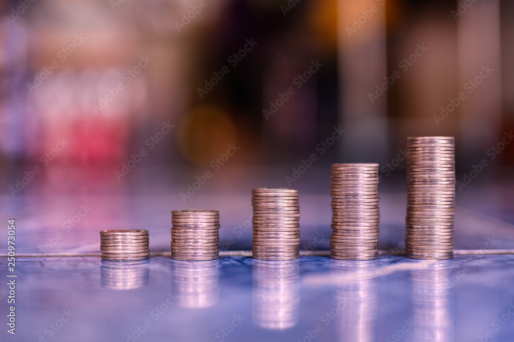 step of coins stacks, money, saving and investment or family planning concept. step of coins stacks, money, saving and investment or family planning concept.