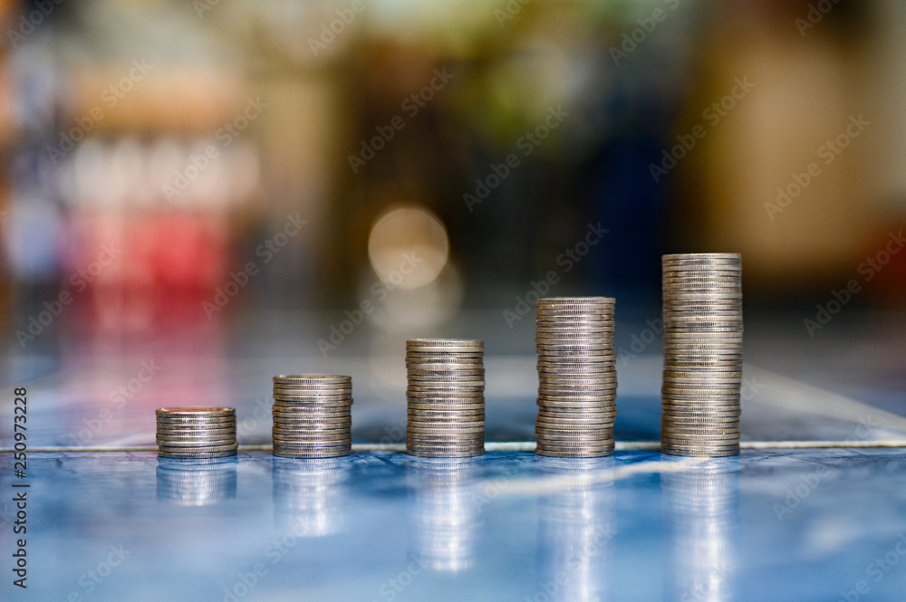 step of coins stacks, money, saving and investment or family planning concept. step of coins stacks, money, saving and investment or family planning concept.