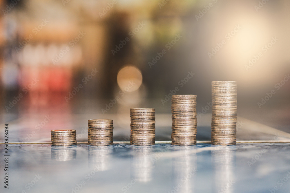 step of coins stacks, money, saving and investment or family planning concept. step of coins stacks, money, saving and investment or family planning concept.