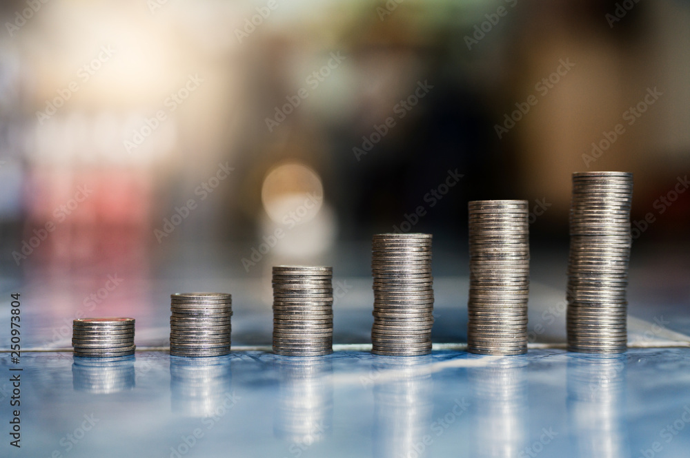 step of coins stacks, money, saving and investment or family planning concept. step of coins stacks, money, saving and investment or family planning concept.