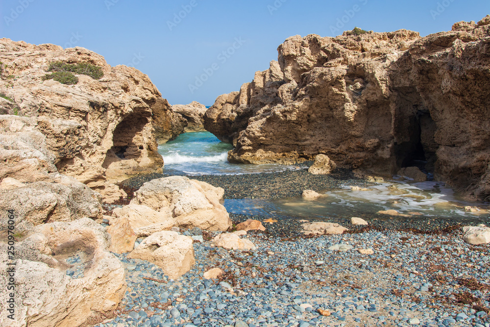 Rocky cliffs on sea beach in Cyprus.