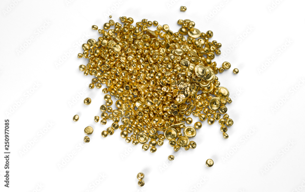 A bunch of pure gold granules isolated on a white background. A bunch of pure gold granules isolated on a white background.