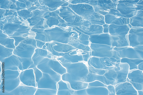 Texture of water in swimming pool for background