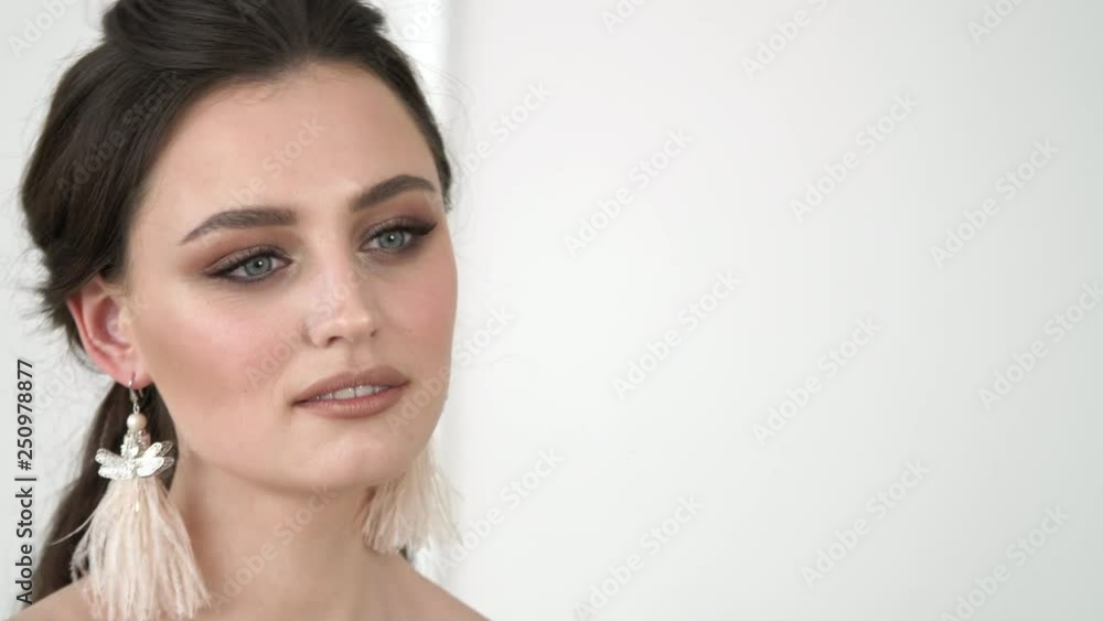 Close up portrait of attractive woman smiling brunette. Emotions of a beautiful girl with fashionable modern makeup Close up portrait of attractive woman smiling brunette. Emotions of a beautiful girl with fashionable modern makeup