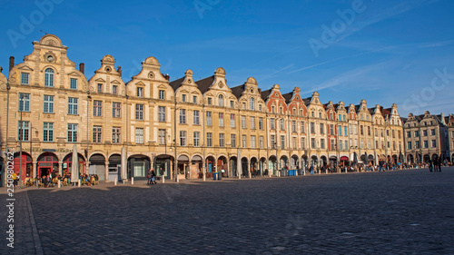 Facades of typical Flemish medieval houses in a square of Arras in France photo