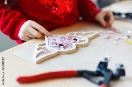 The process of stroking the heart from a mosaic.