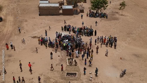 African Village in savannah - people at water well - circular tracking