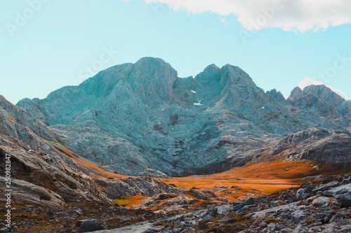 Beautiful Mountain Mars Fantastic Landscape, rocks and teal sky with white cloud