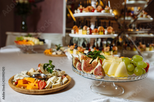 Variety assortment of different luxury food snacks and appetizers, concept of decorated catering banquet set, on a party event celebration