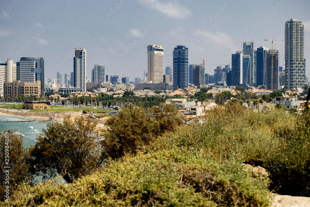 Tel Aviv beach coast with a view of Mediterranean sea and skyscrapers. Tel Aviv, Israel. 15-09-2015
