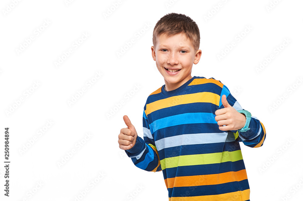 gesture, childhood, fashion, advertisement - happy smiling boy in colored strips t-shirt showing thumbs up gesture, childhood, fashion, advertisement - happy smiling boy in colored strips t-shirt showing thumbs up