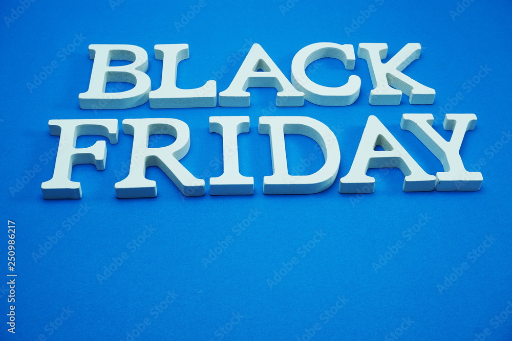 Black Friday sale shopping concept alphabet on blue background Black Friday sale shopping concept alphabet on blue background