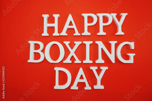 Happy Boxing Day alphabet letters on red background