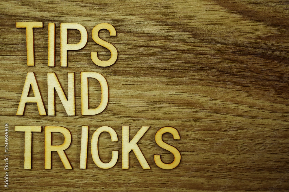 Fototapeta premium Tips and Tricks text message on wooden background