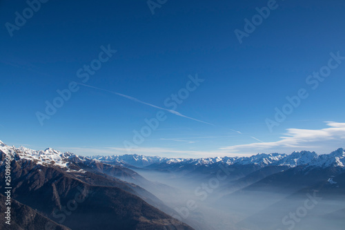 Mountains during winter with snow and fog