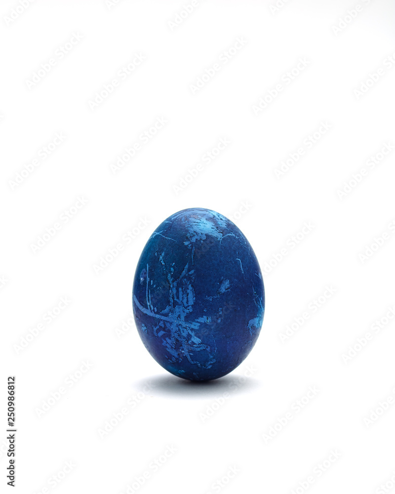 Decorated Blue Easter egg on white background
