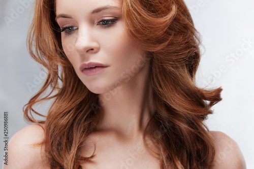 Portrait of young beautiful red-haired woman Caucasian type