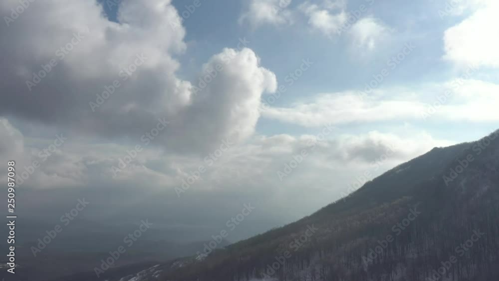 Mountain top in the mist and clouds before sunset 4K aerial video Mountain top in the mist and clouds before sunset 4K aerial video