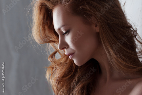 Portrait of young beautiful red-haired woman Caucasian type