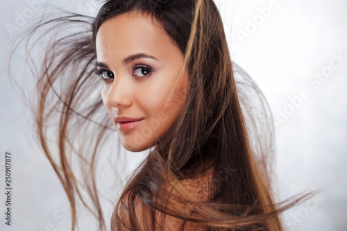 Young charming brunette. Beauty portrait of a young beautiful woman