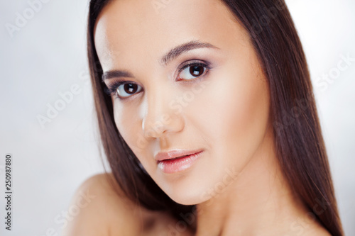 Young charming brunette. Beauty portrait of a young beautiful woman