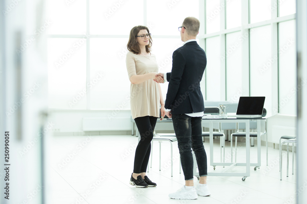 welcoming handshake of a Manager and the customer in the office welcoming handshake of a Manager and the customer in the office