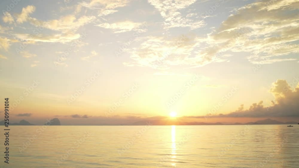 Amazing panoramic video of calm seascape with orange sun rising over the Indian ocean Amazing panoramic video of calm seascape with orange sun rising over the Indian ocean