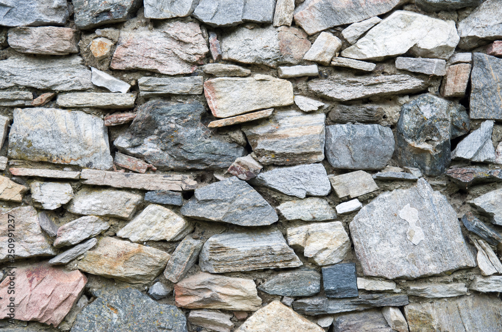 Fototapeta premium Old relief colorful stone wall