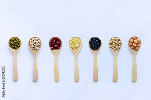 Different beans, legumes on wooden spoon
