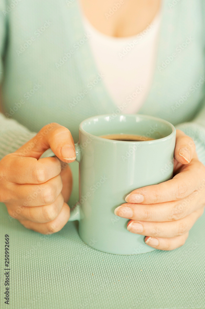 a woman with aquamarine mug filled with coffee like concept love for coffee a woman with aquamarine mug filled with coffee like concept love for coffee