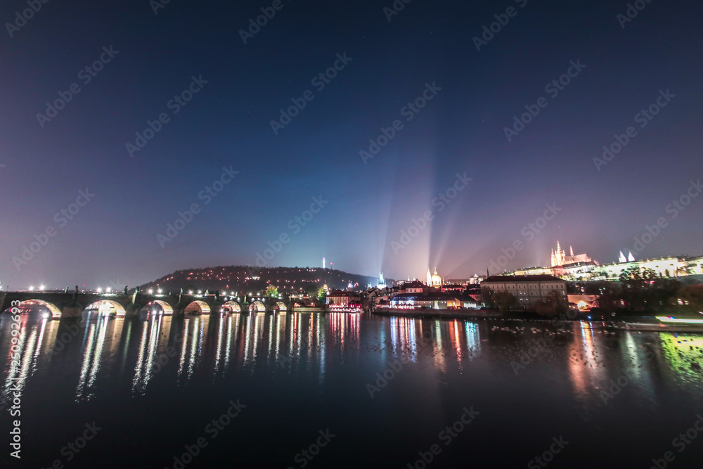 View on Charles bridge on Vltava river in Prague at night, Czech Republic
