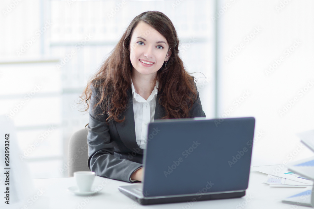successful business woman sitting at the Desk in the office successful business woman sitting at the Desk in the office