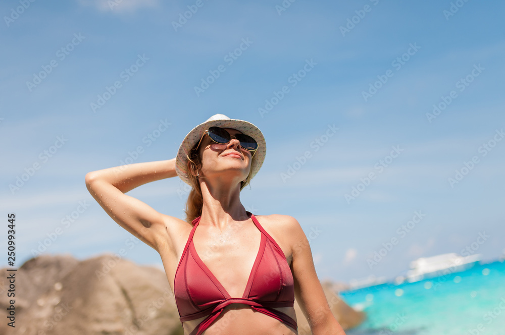 Happy woman enjoying beach relaxing joyful in summer by tropical blue water. Beautiful model girl. Asia Happy woman enjoying beach relaxing joyful in summer by tropical blue water. Beautiful model girl. Asia