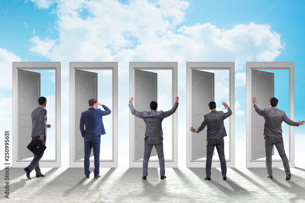 Fototapeta premium Businessman in uncertainty concept with many doors