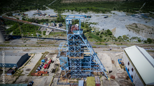Abandoned mine shaft headgear seen from above on a sunny day