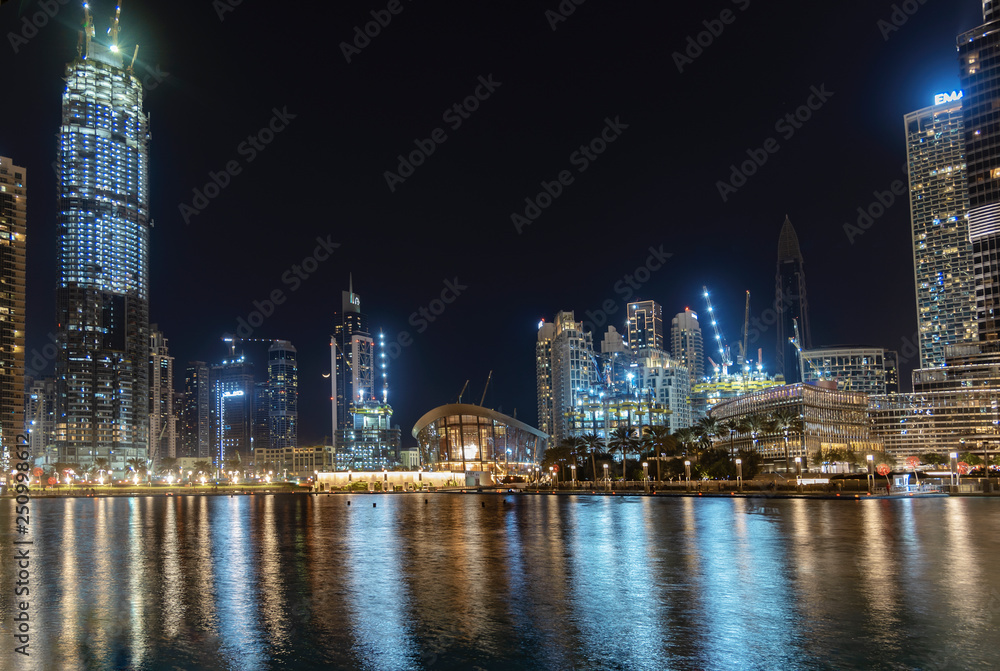Buildings of Dubai across the water at night
