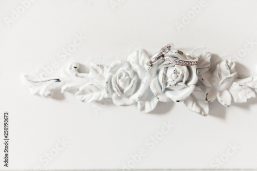 Wedding rings on wooden roses