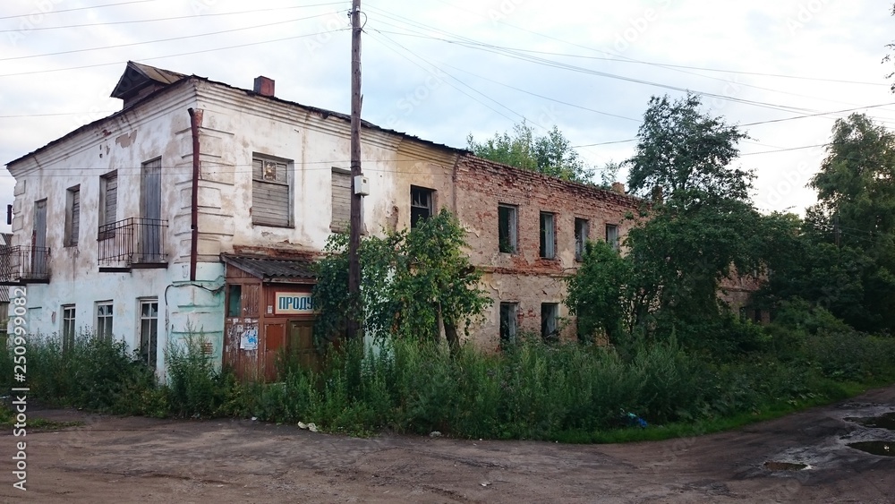 Abandoned brick and wooden houses in pishchita, located in Ostashkov, Tver region, Russia.