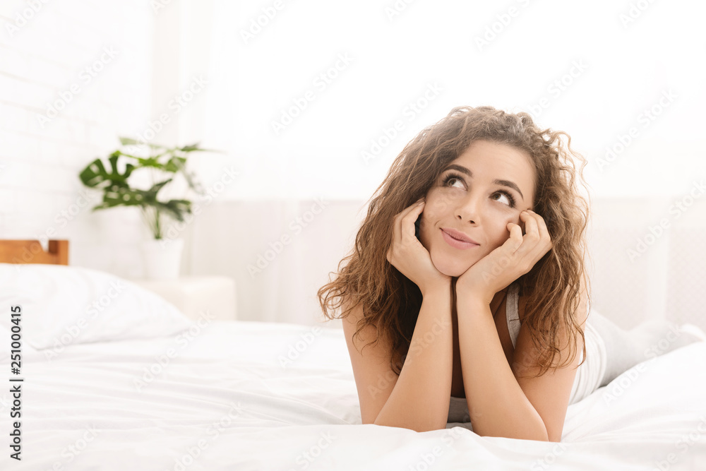 Pretty girl making plans for day in bed Pretty girl making plans for day in bed