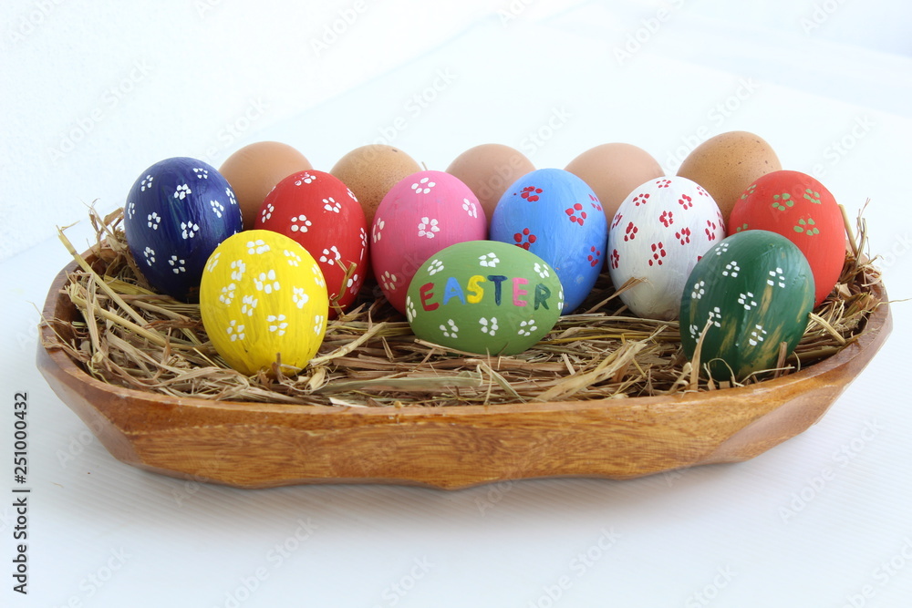 colorful easter eggs in a basket colorful easter eggs in a basket