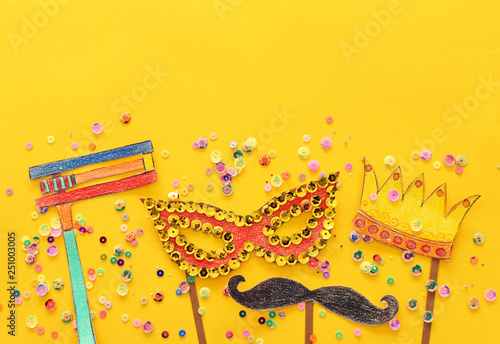 Purim celebration concept  jewish carnival holiday . Traditional symbols shapes cutted from paper