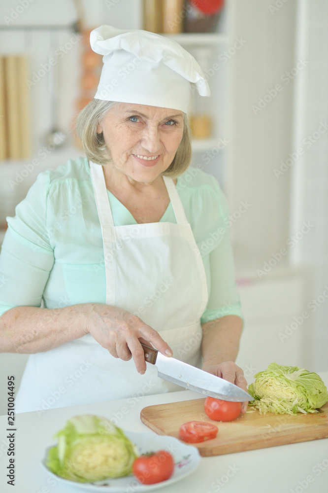 Portrait of senior woman chef portrait at kitchen Portrait of senior woman chef portrait at kitchen