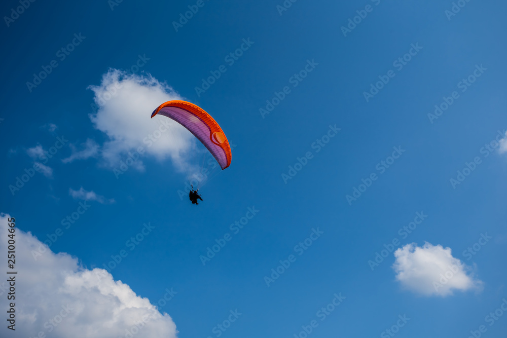 closeup paraglider fly in a blue sky closeup paraglider fly in a blue sky